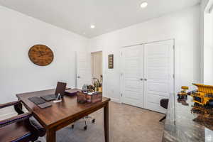 Office area featuring light carpet and recessed lighting