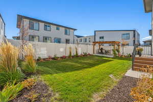 View of yard featuring a pergola and a patio area