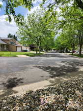 View of asphalt road with curbs