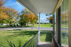 Balcony featuring a porch and a mountain view