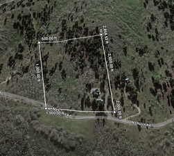 Aerial map of property and surrounding area with property parcel outlined