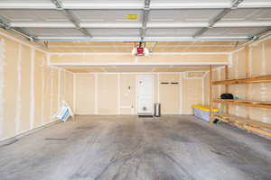 Garage featuring a garage door opener