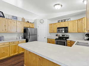 Open/large kitchen with bar in foreground and corner pantry