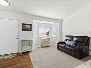 Off-entry sitting room with bay window