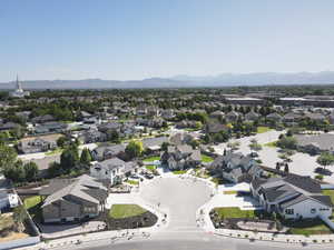 Aerial view of residential area featuring a mountainous background