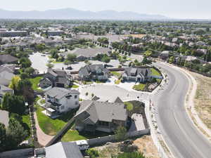 Aerial perspective of suburban area featuring a mountain backdrop