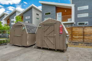 View of shed featuring fence