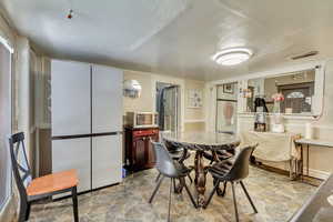 Dining room featuring stone flooring
