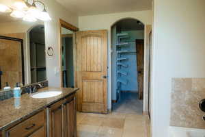 This beautiful bathroom is open and spacious and leads into the large walk in closet.