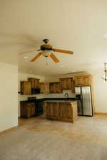 The staggered knotty alder cabinets bring interest and design.  And... you'll love to know that the fridge is included.