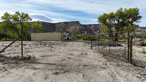 View of yard featuring a gate and a mountain view