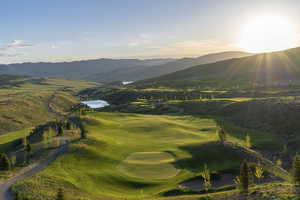 View of community featuring a mountain view and view of golf course