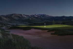 View of property's community with a mountain view and view of golf course