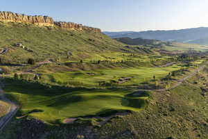 View of mountain background featuring a local golf course