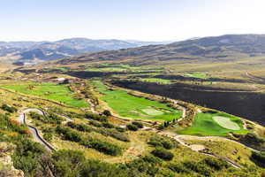 Drone / aerial view of mountains and a local golf course