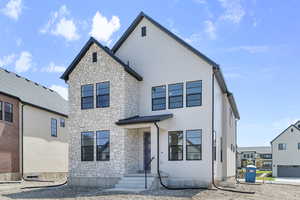 View of front of property featuring stone siding
