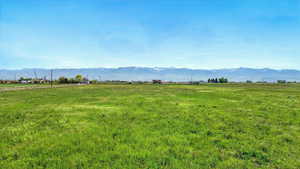 View of mountain background featuring rural landscape