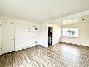 Spare room with wood finished floors and baseboards