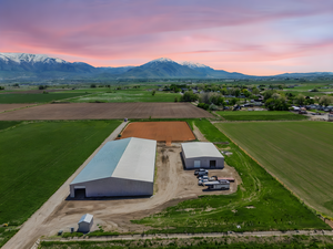 Aerial view at dusk of a mountain view and a view of rural / pastoral area