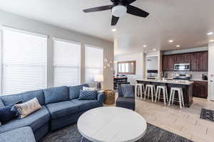 Living room featuring recessed lighting and ceiling fan