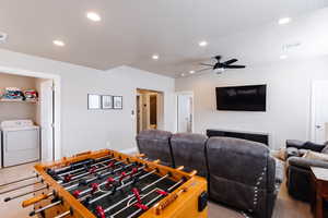 Playroom with washer / clothes dryer, recessed lighting, and a ceiling fan