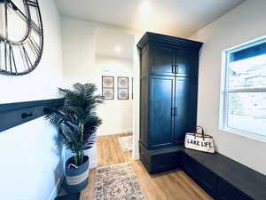 Mudroom featuring light wood-style floors, baseboards, and recessed lighting