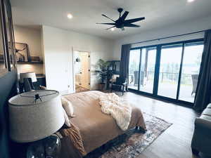 Bedroom with access to outside, recessed lighting, wood finished floors, ensuite bathroom, and a ceiling fan