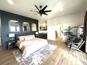 Bedroom featuring wood finished floors, recessed lighting, and a ceiling fan