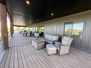 Wooden deck featuring an outdoor hangout area