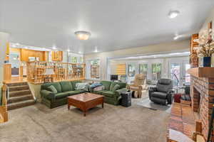 Living area with carpet floors and stairs