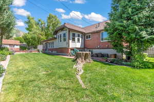 Rear view of house with brick siding