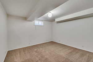 Basement with carpet flooring and baseboards