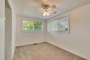 Bedroom featuring plenty of natural light, carpet flooring, and baseboards