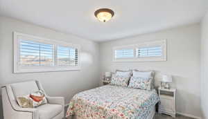 Carpeted bedroom with baseboards