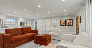 Living area featuring recessed lighting and baseboards