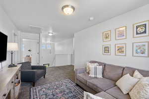 Loft featuring carpet floors