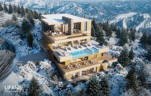 Snowy aerial view featuring a mountain view