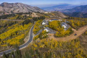 Aerial view of property's location with a mountainous background