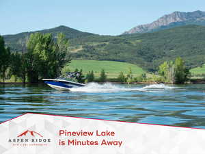 Water view with mountains and a heavily wooded area