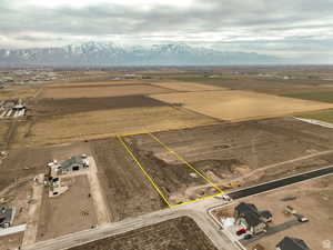 Overview of rural landscape featuring property parcel outlined and mountains
