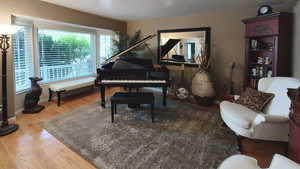 Living area featuring wood finished floors and baseboards