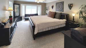 Bedroom with light carpet