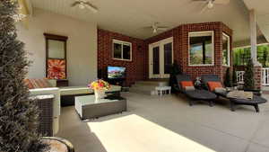 View of patio featuring ceiling fan, outdoor lounge area, and french doors