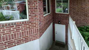 Property entrance with brick siding