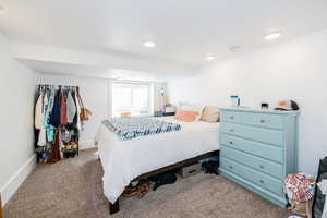 Bedroom with carpet, baseboards, and recessed lighting