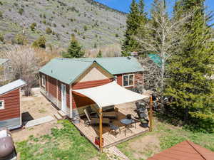 View from above of property with a mountain backdrop
