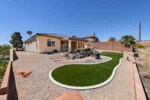 Back of property with a pergola, a patio area, a tile roof, stucco siding, and fence