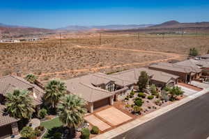 Aerial view of sparsely populated area featuring mountains and a desert landscape