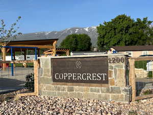 Community sign featuring a mountain view