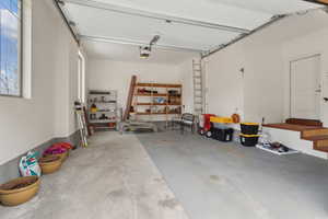 Garage featuring a garage door opener